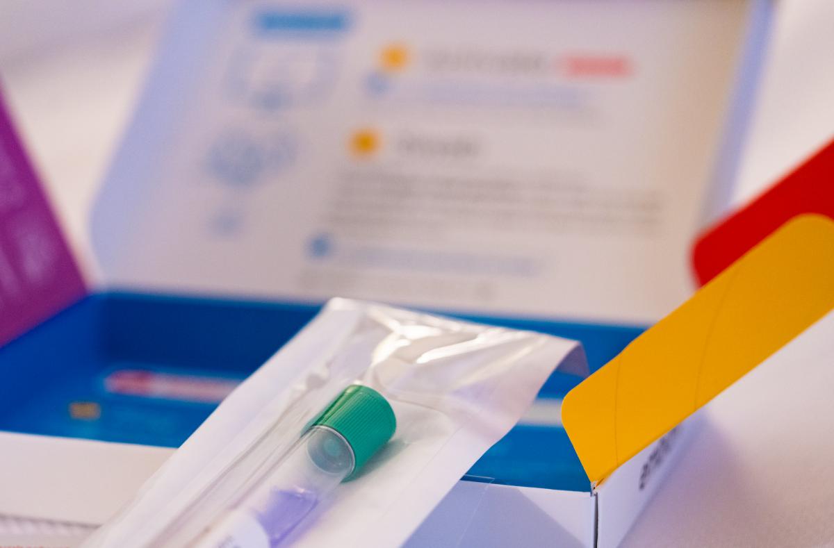 Close-up photo of a DNA testing kit and tube