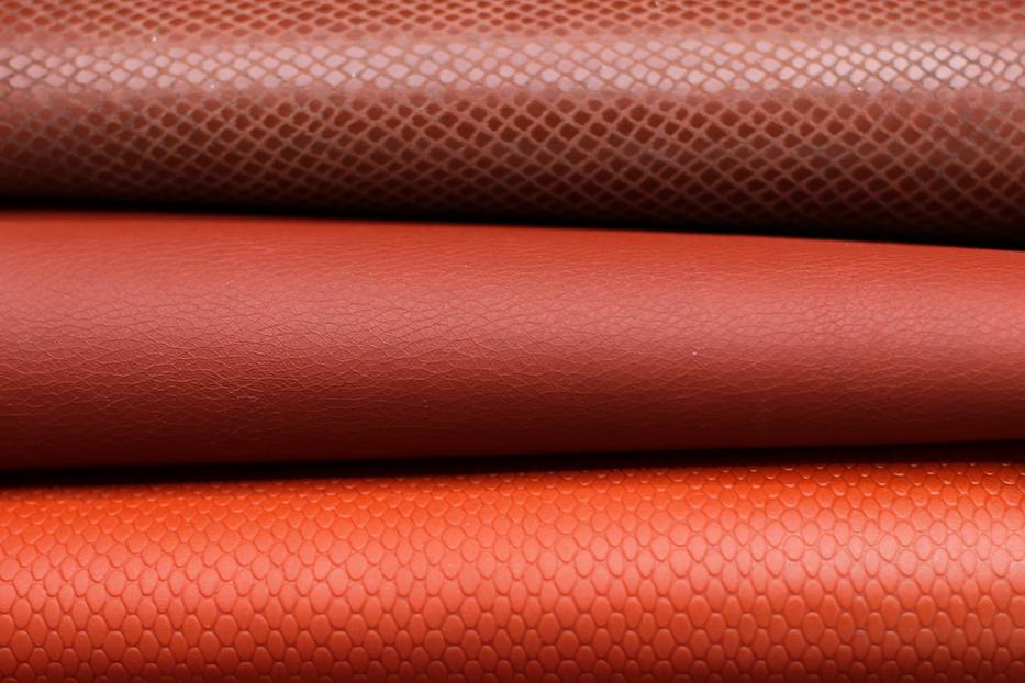 three types of red bioleather stacked 