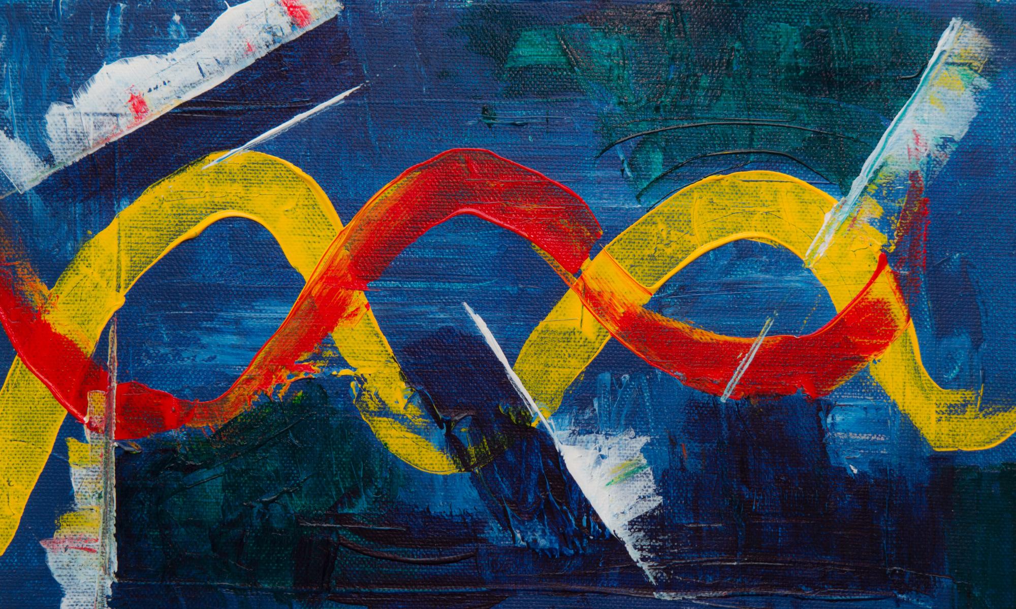 A canvas painting with a blue background, yellow and red complimentary squiggle along with swatches of green, white and deeper blue on the sides and the bottom of the canvas.